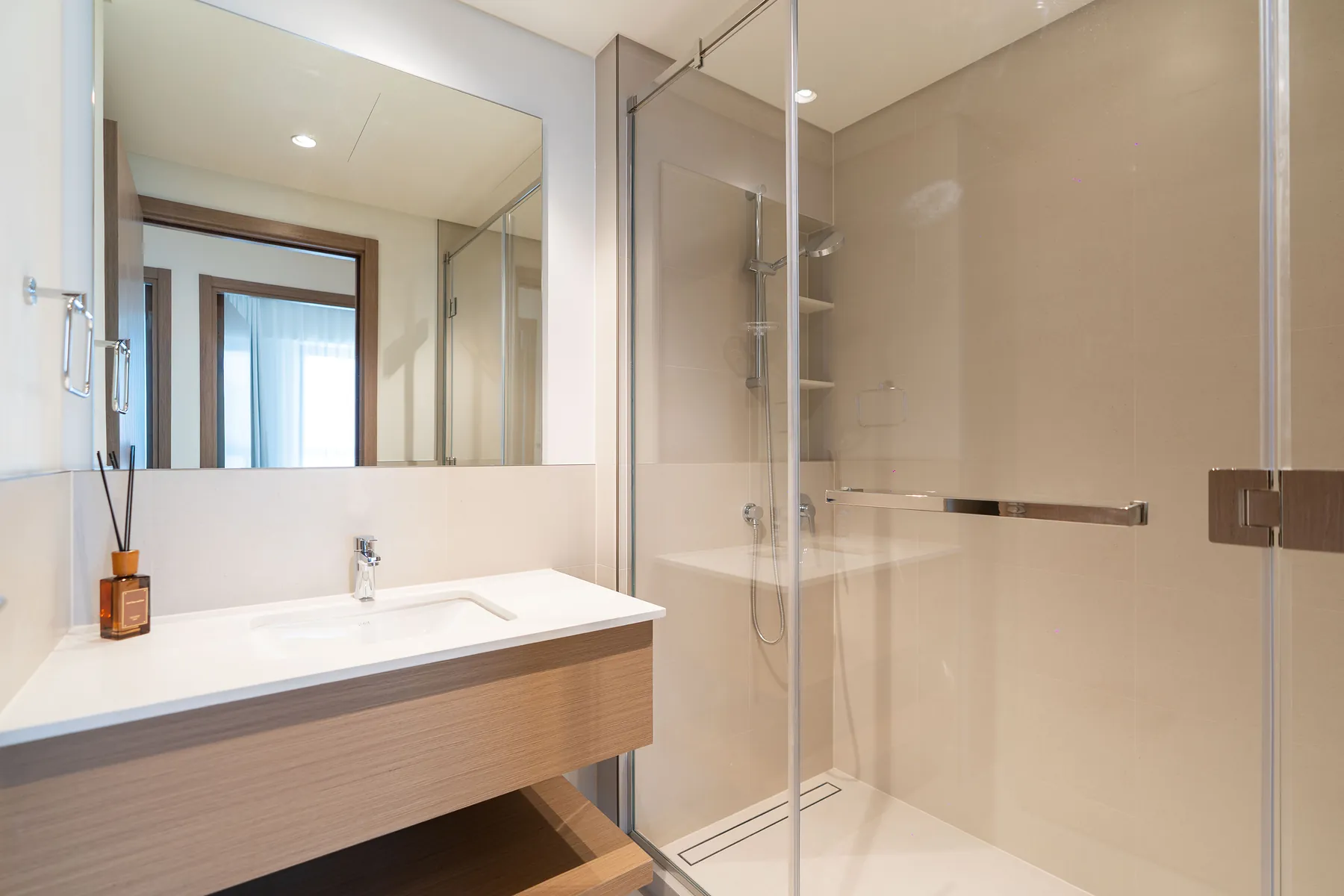 Bathroom with timber vanity, mirror and glass walk-in shower